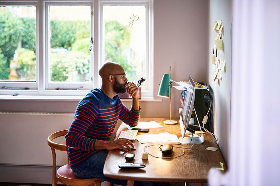 Person sitting at desk working on computer