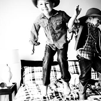 Visio Lending Customer Image: Children playing on a bed