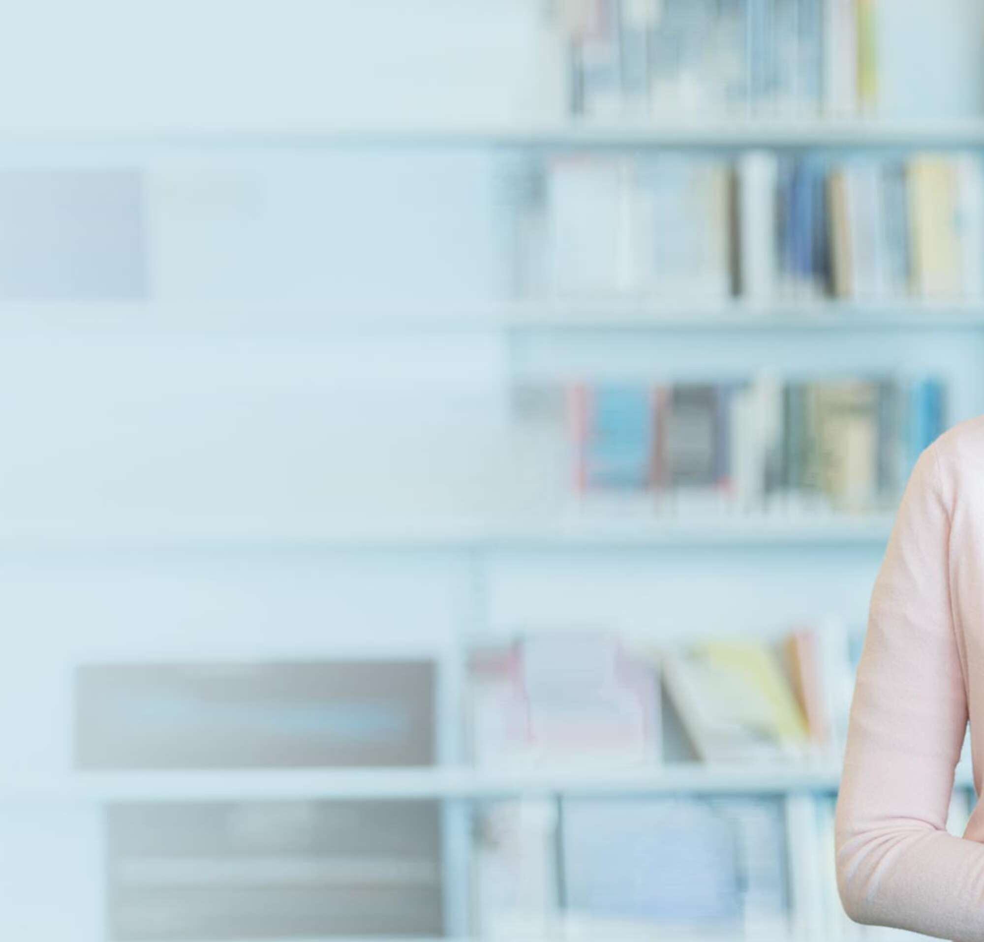 Teacher with textbooks in her office.