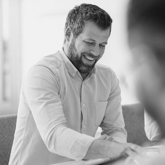 Smiling man in meeting