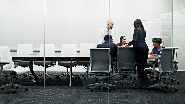 Professional people working in a modern conference room.